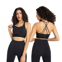 A model is shown from the front and back wearing a black sports bra and matching high-waisted leggings against a plain white background.